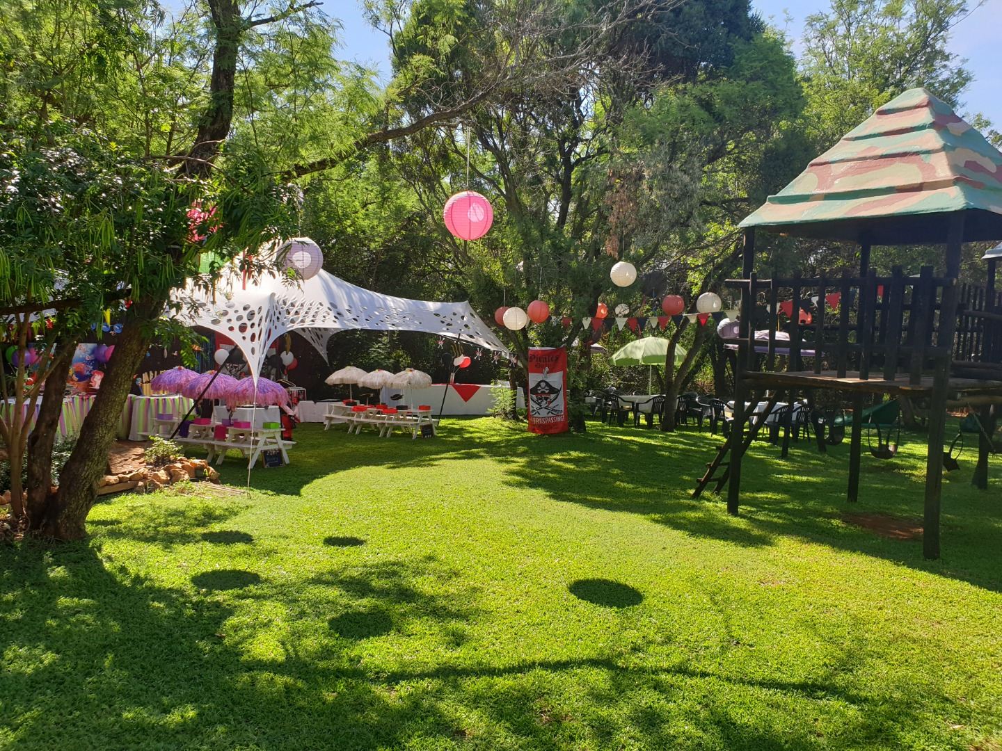 Stretch tent tea party set up on the garden lawn
