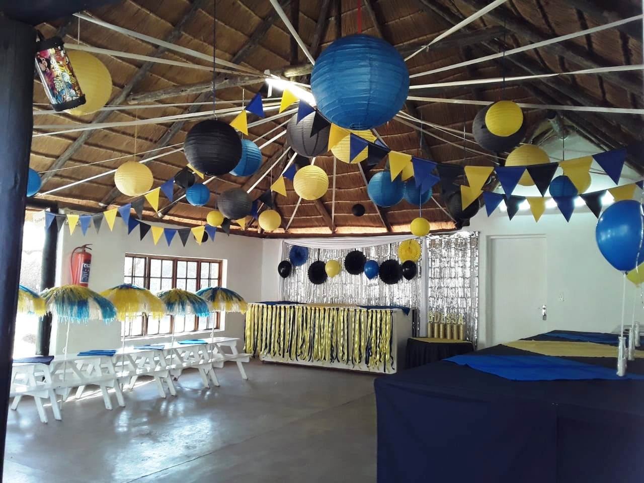 Corporate function d&eacute;cor with blue and yellow lanterns
