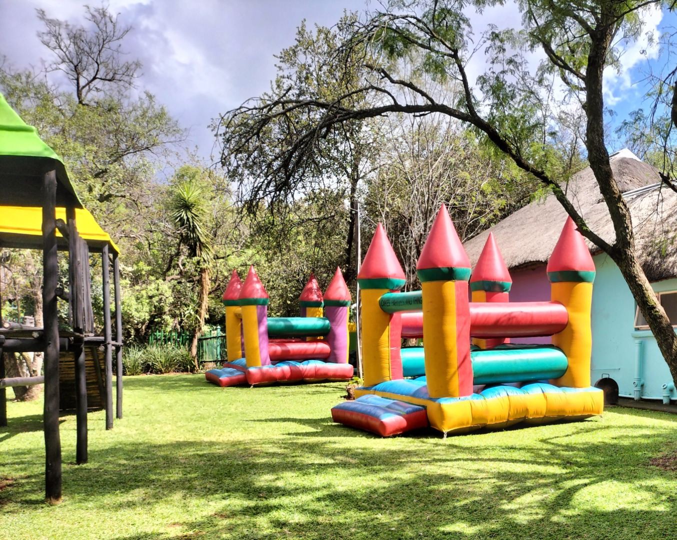Colourful jumping castle set up on the lawn for a party