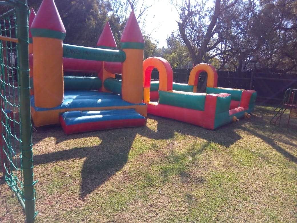 Two large jumping castles set up on the lawn