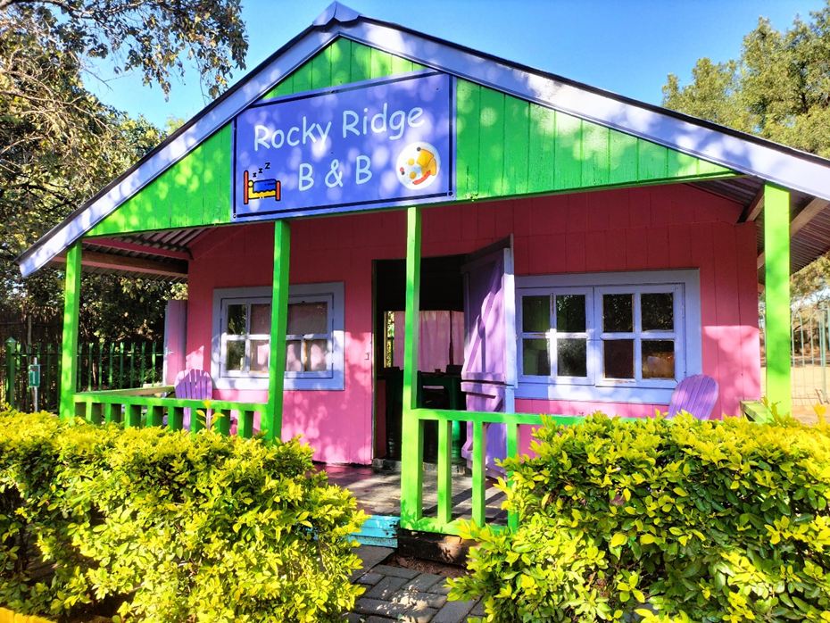 The pink Rocky Ridge B&B playhouse in the Fantasy Mini-Town