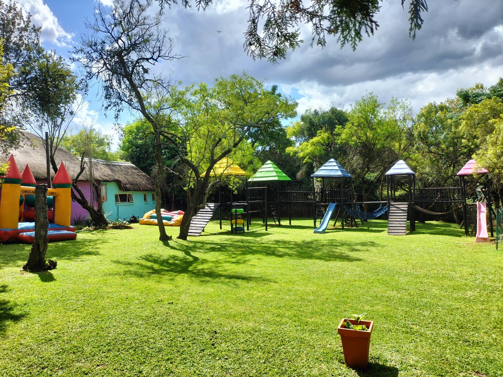 Play equipment and jumping castles in front of the lapa