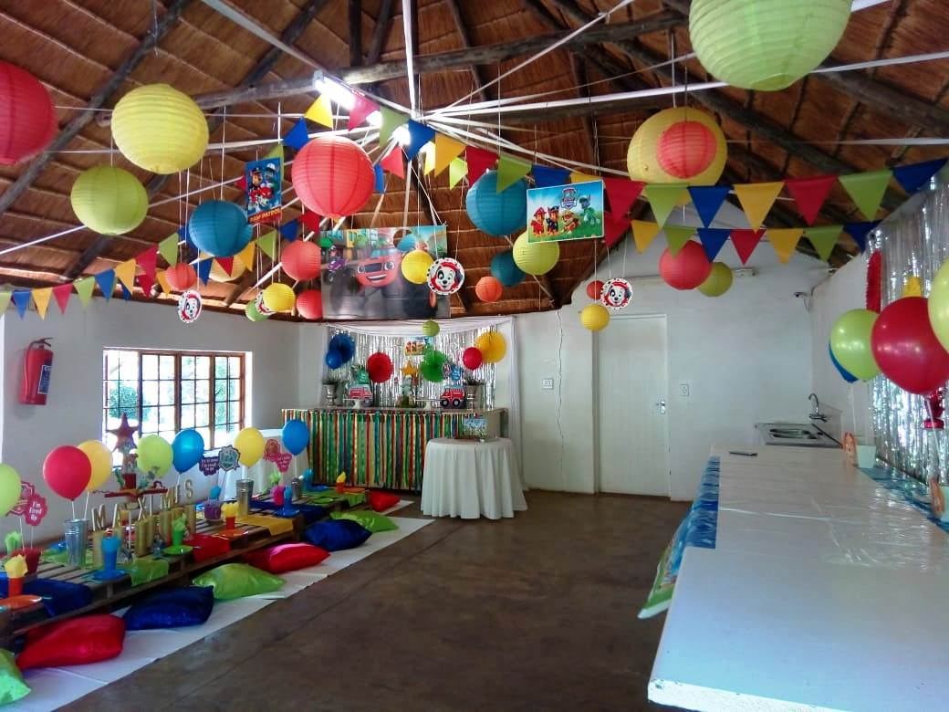 Rainbow lanterns and bunting across the lapa roof