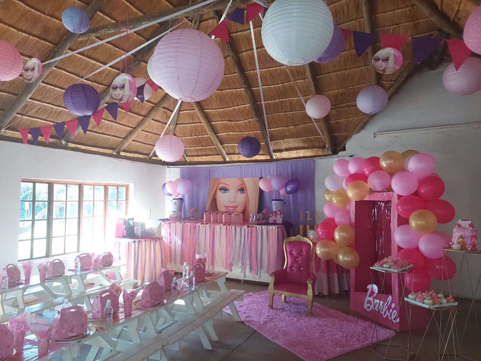 Barbie themed d&eacute;cor set with pink balloons and backdrop