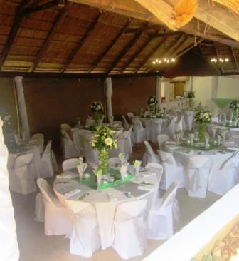 Wedding reception with white table settings and greenery in the lapa