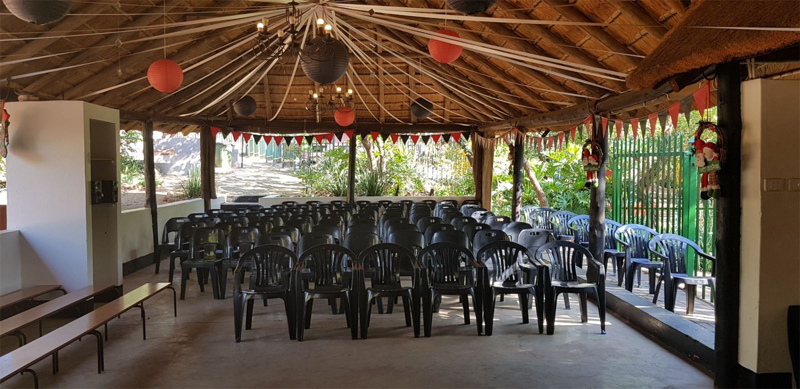 Seating laid out under the thatched lapa for a ceremony