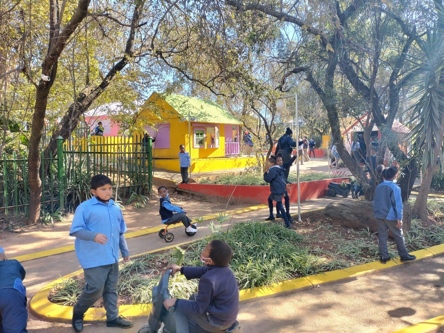 Children exploring the Mini-Town roads during an outing