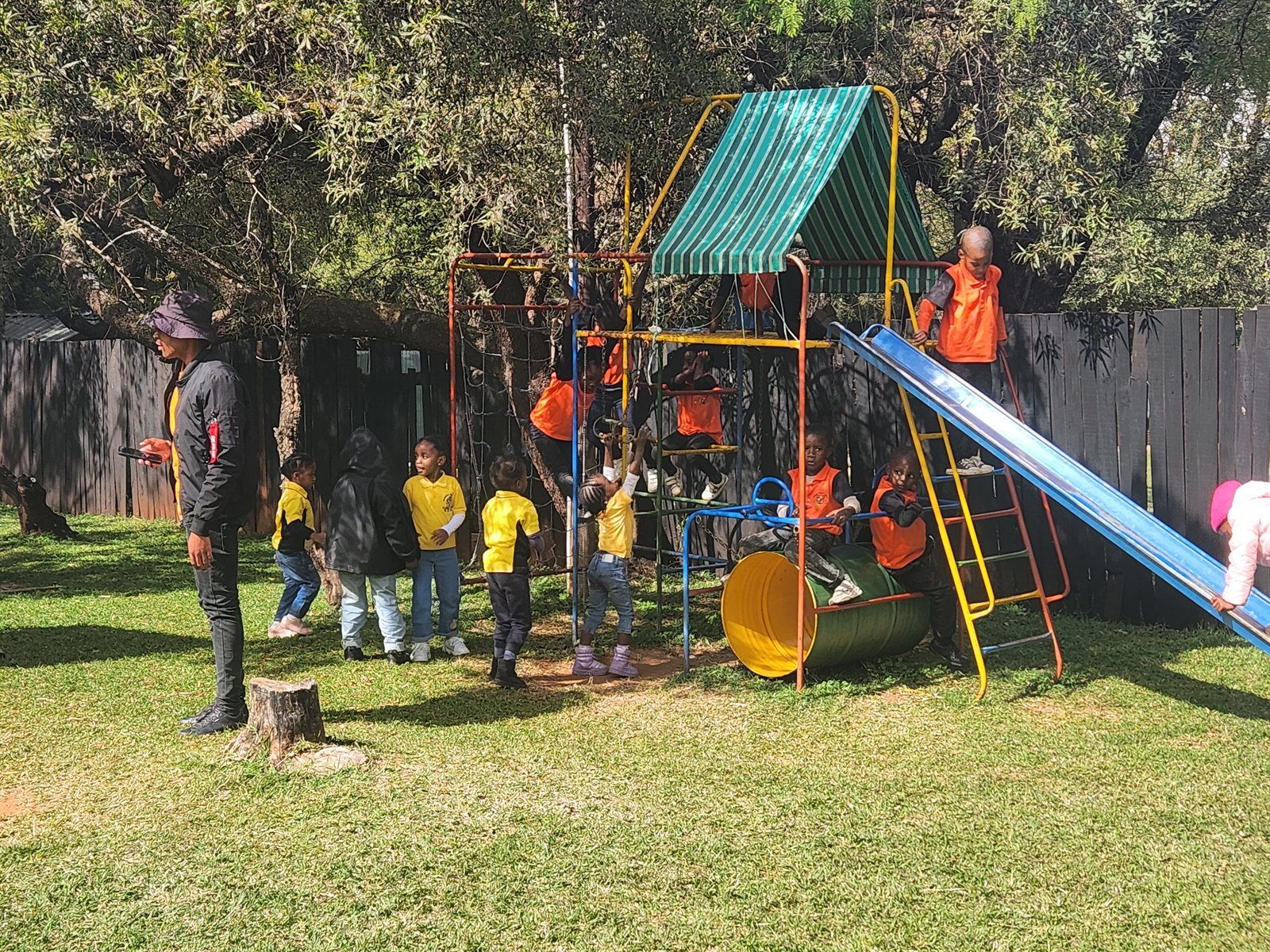 School children playing on the play equipment