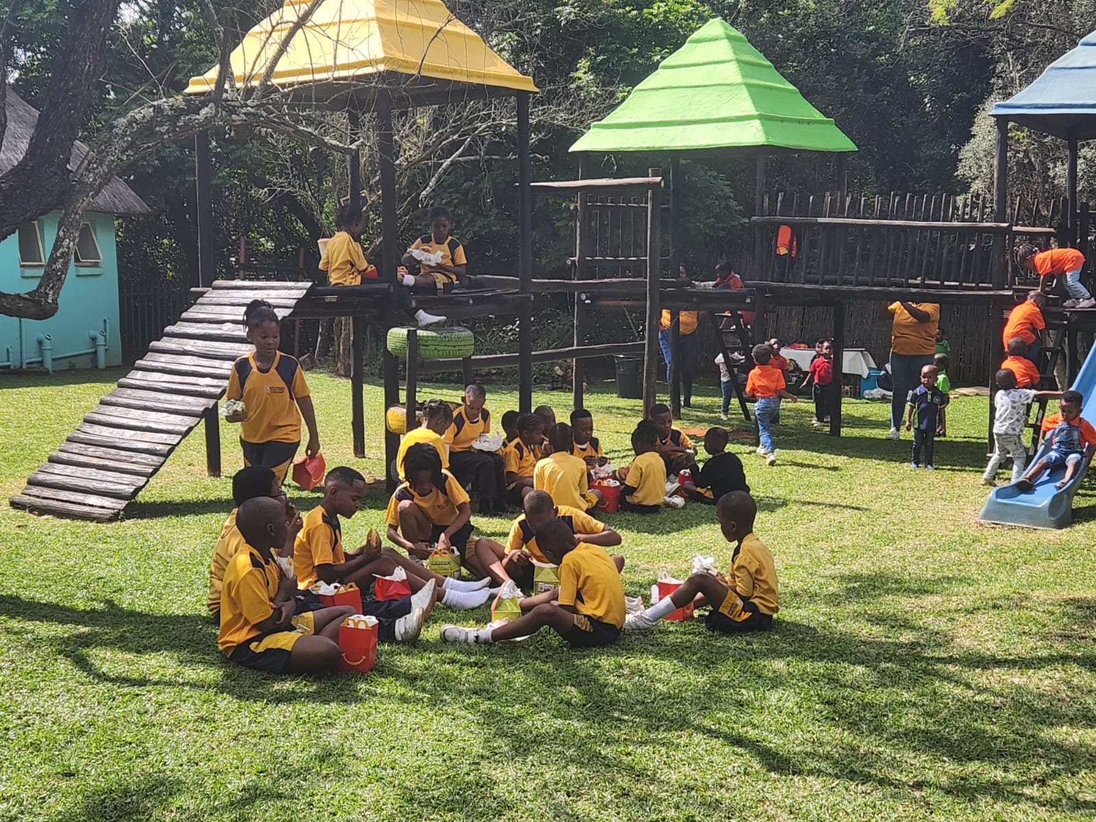 Pupils spread across the lawn at the play frames