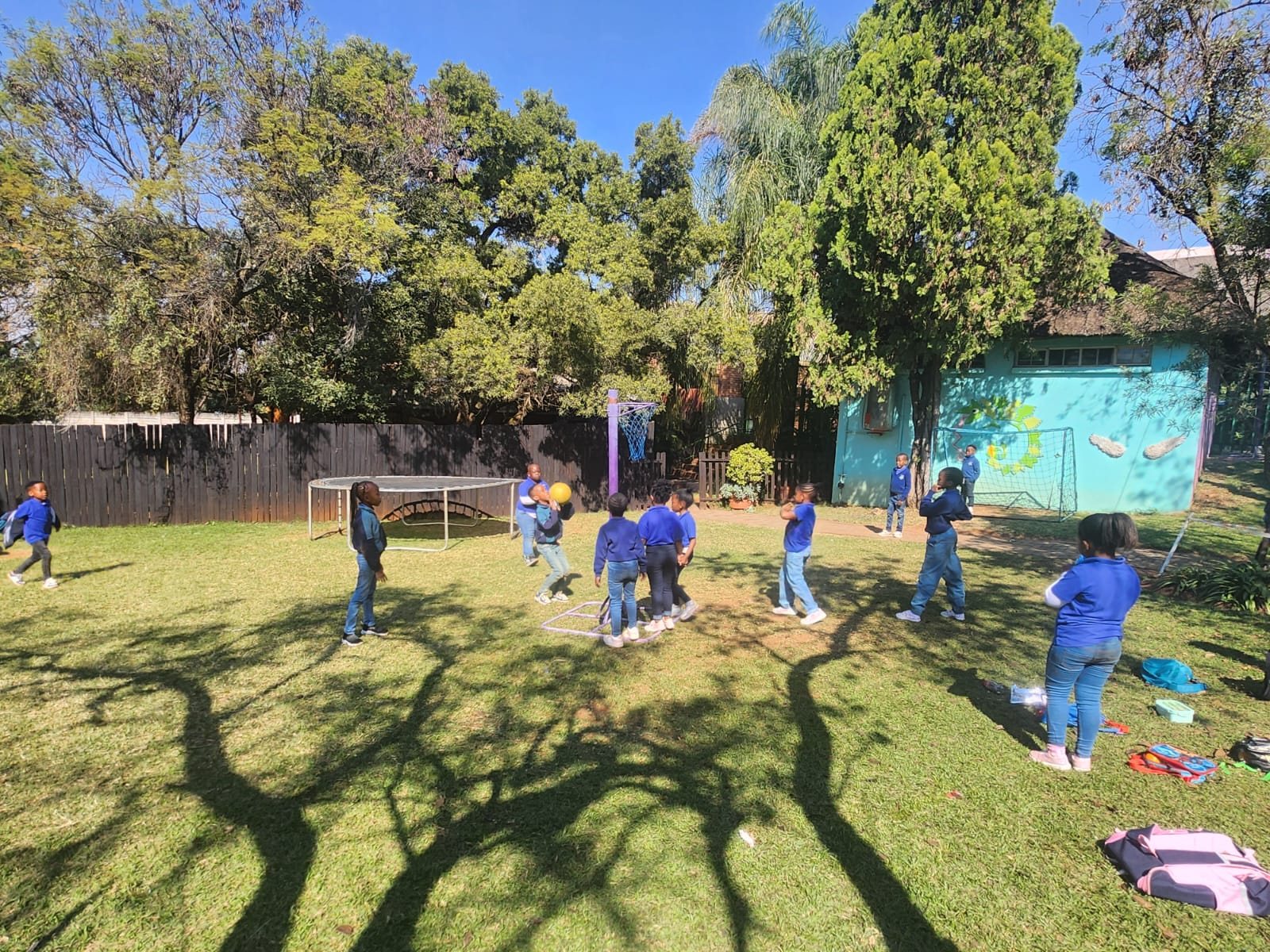 Children playing on the lawn during a school outing
