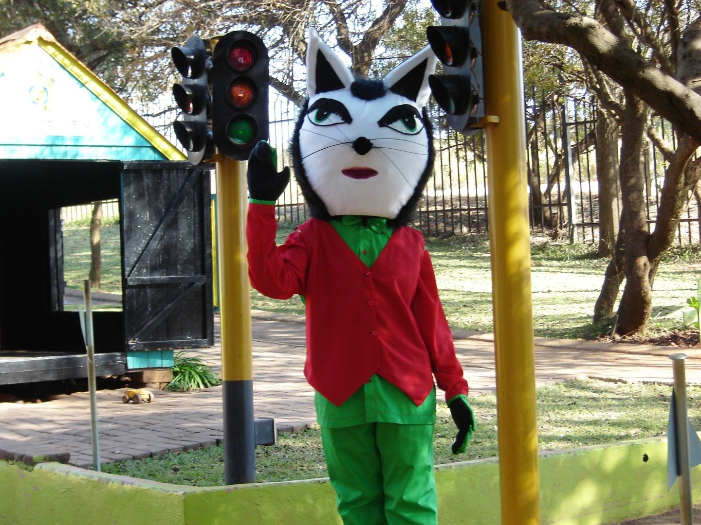 Danny Cat mascot next to the traffic light in the Mini-Town