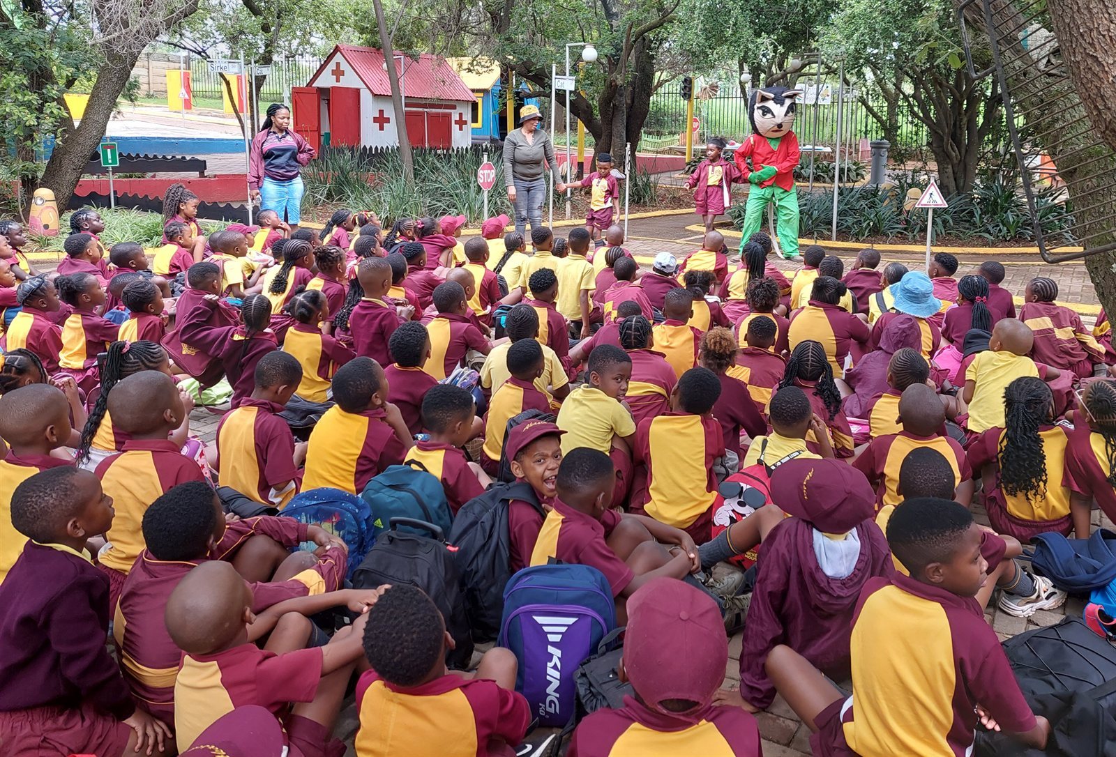 Pupils seated in the Mini-Town for the programme